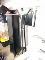 Full view of coat rack beside cabinet