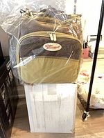 Bag in plastic on top of original box