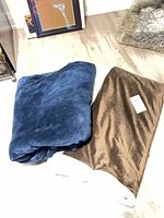 Blue and brown blankets folded side-by-side