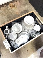 Crate containing complete porcelain set showing quantity and packing