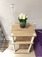 Top view showing floral pot on upper shelf and table surface