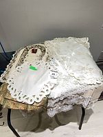 Overall view of assorted linens on table