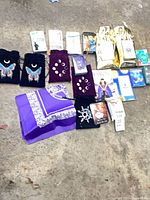 Group layout of all decks, book, cloth and pouches