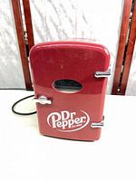 Front view showing Dr Pepper logo, latch, and power cord