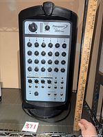 Front view showing mixer panel and overall cabinet