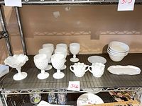 Full lot on shelf showing all milk glass pieces and Pfaltzgraff bowls