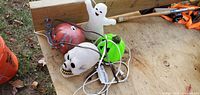 All four Halloween light-up decorations grouped on table showing cords