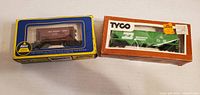 AHM brown hopper and Tyco green hopper in boxes side by side