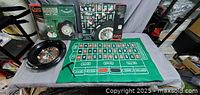 Entire roulette set with wheel, felt, rake and packaging
