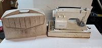 Sewing machine and carry case side by side