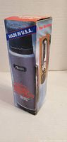 Front of boxed Aladdin Rugged American thermos