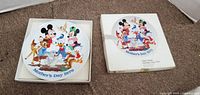 Front of plate in box alongside box lid showing Walt Disney character scene and Mother’s Day 1979 caption