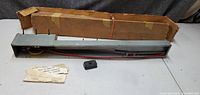 Top view of Lionel 364 lumber loader with instruction sheet, controller and original box