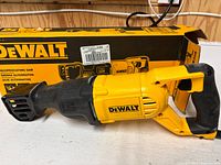 Reciprocating saw set in front of original box