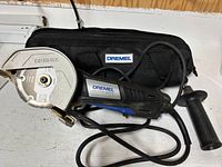 Saw, case, handle and cable overall view