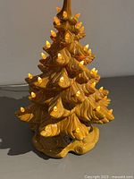 Complete ceramic tree lamp illuminated showing amber bulbs and base