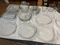All glass bakeware and storage pieces laid out on counter