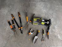 All tools and boxed Yardworks sprinkler laid out