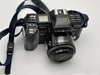 Top view of Minolta Maxxum 7000 with 50mm lens and strap attached