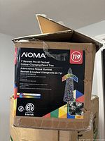 Retail box front showing NOMA Bennett 7' Pre-lit Flocked Colour-Changing Pencil Tree graphics and specs