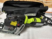 Compact Rockwell VersaCut saw with cord and carry bag