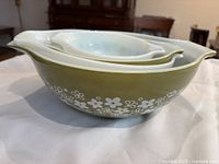 Stacked nesting Pyrex bowls showing exterior colors and pattern