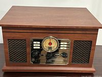 Front view of Victrola stereo showing speaker grilles and control panel