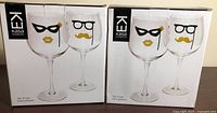 Two boxed sets of Kasa Elements wine glasses front view