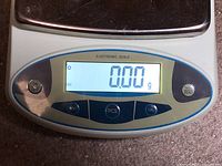 Close view of control panel and display reading 0.00 g