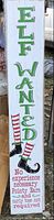 Front view of entire vertical Elf Wanted sign