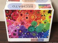 Front view of multicolour flower collage puzzle box