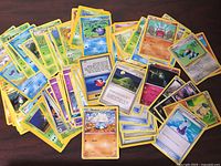 Mixed spread of Pokémon cards on tabletop