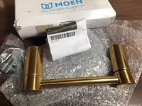 Toilet paper holder, screws, bubble wrap, damaged Moen box