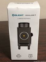 Front of sealed retail box showing brand, model and specs