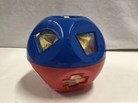 Blue/red Shape-O sphere showing square and triangle openings with blocks inside