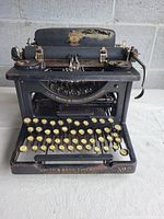 Front view showing full keyboard and front nameplate