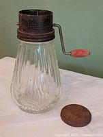 Full view of jar, grinder top attached, lid beside