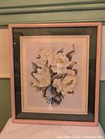 Front view of framed airbrushed floral picture