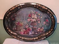 Full view of oval hand-painted metal tray showing entire artwork and border