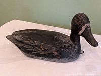 Left side view of carved wooden duck decoy