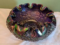 Top view showing interior grape motif and ruffled rim