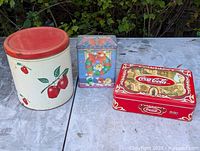 All three tins side by side