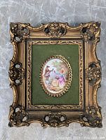 Full view of ornate gold plastic frame with picture