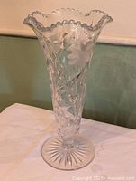 Full view of clear Cornflower cut glass vase on table