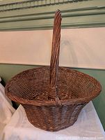 Overall view of wicker basket showing handle and body