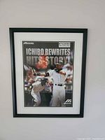 Full view of framed Ichiro Suzuki poster on wall