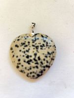 Front view of heart-shaped Dalmatian jasper pendant with bail