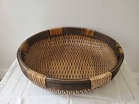 Overall view of woven oval basket on table