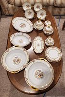 Full lot overview showing all porcelain pieces on table