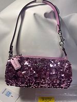Full view of purple sequin Coach evening bag with handle